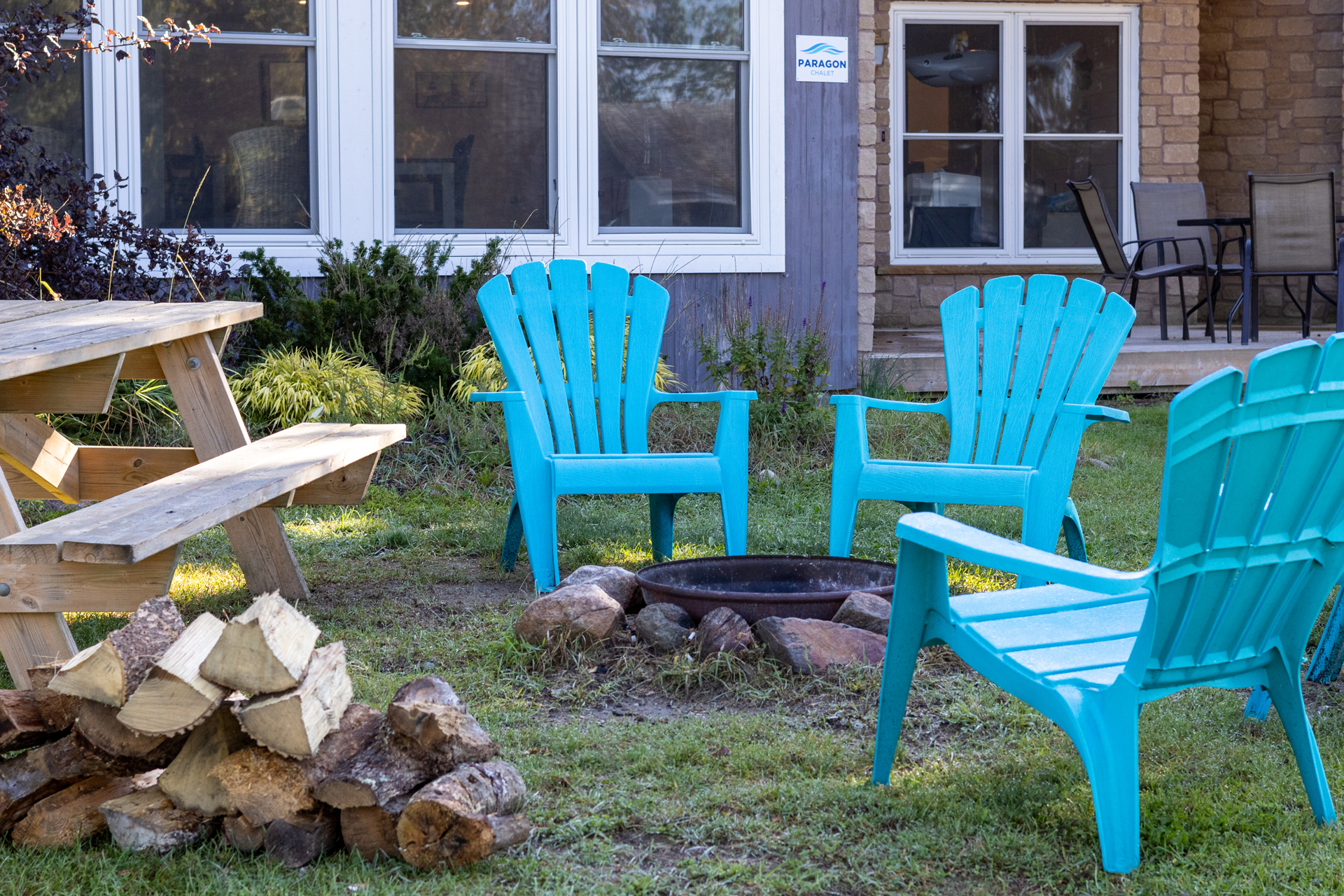 Fire pit with Muskoka Chairs at Honey Harbour Cottage Rental