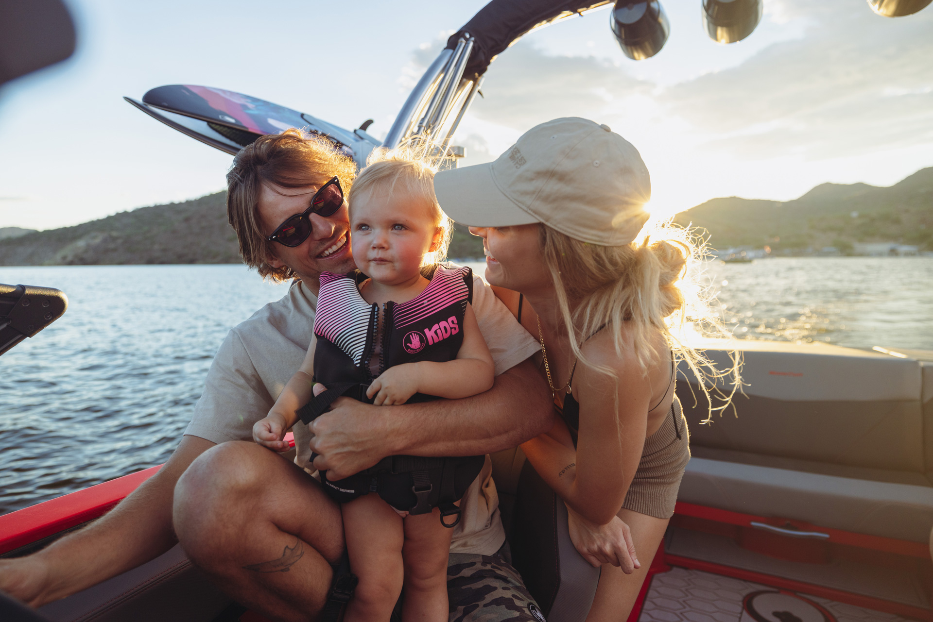 young family with baby on wake surf boat in Ontario