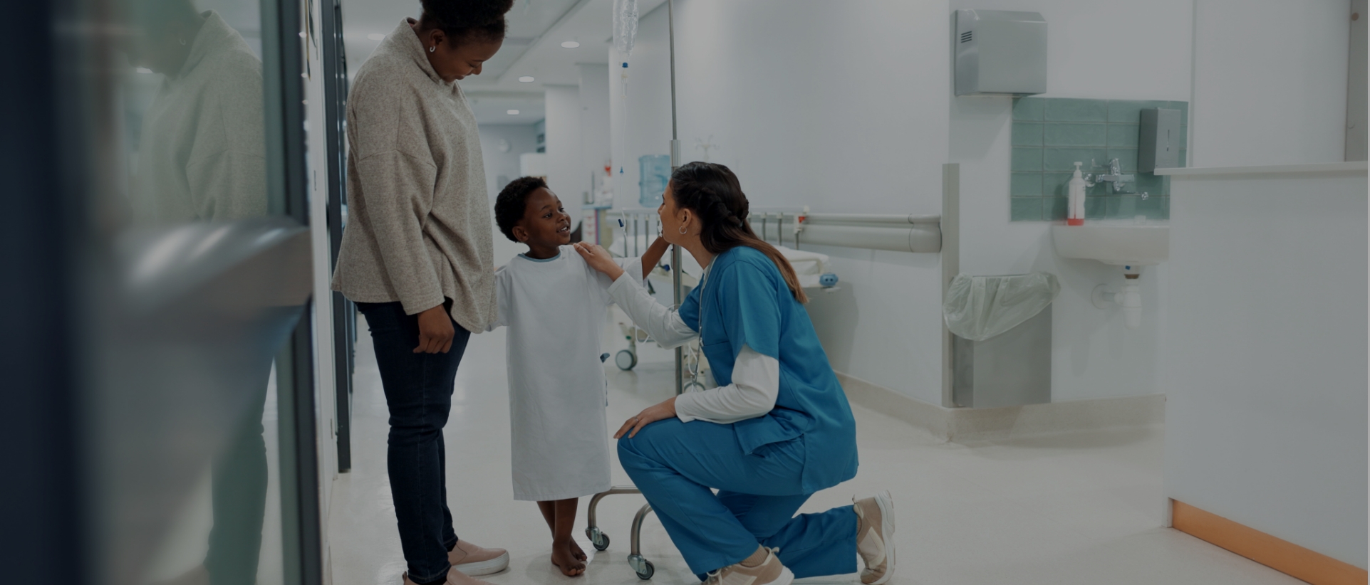 Doctor assisting child patient and parent in Georgian Bay Hospital